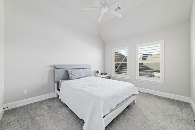 carpeted bedroom with vaulted ceiling and ceiling fan