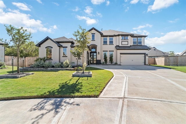 view of front facade featuring a garage and a front yard