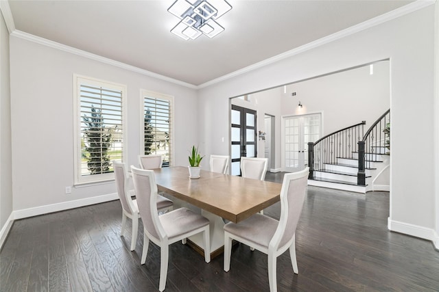 dining area featuring crown molding, dark hardwood / wood-style floors, and french doors