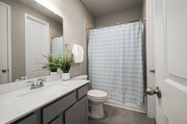 full bathroom with vanity, toilet, tile patterned flooring, and shower / bath combo with shower curtain