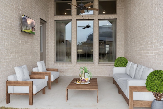 view of patio with ceiling fan and an outdoor living space