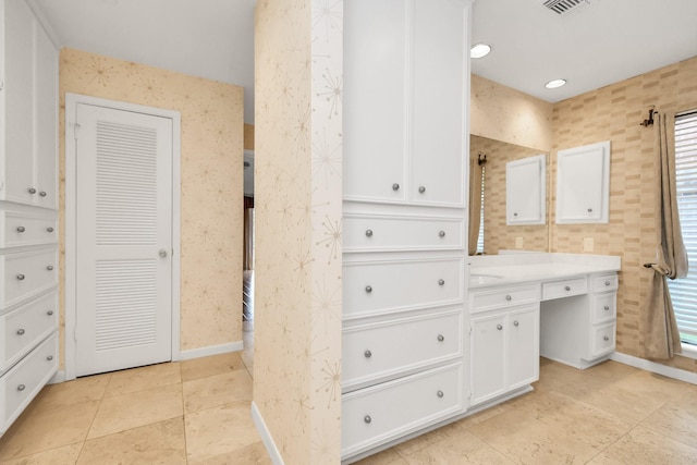 bathroom with vanity and tile patterned flooring