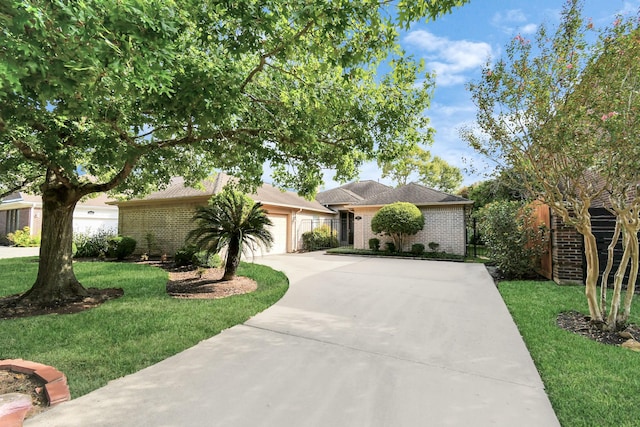 ranch-style house with a garage and a front lawn