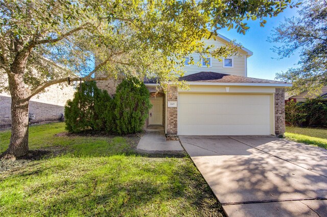 view of front facade with a garage and a front yard