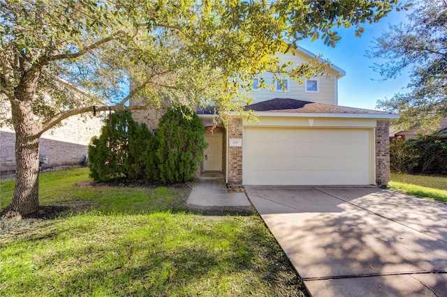 view of front of property featuring a garage and a front yard