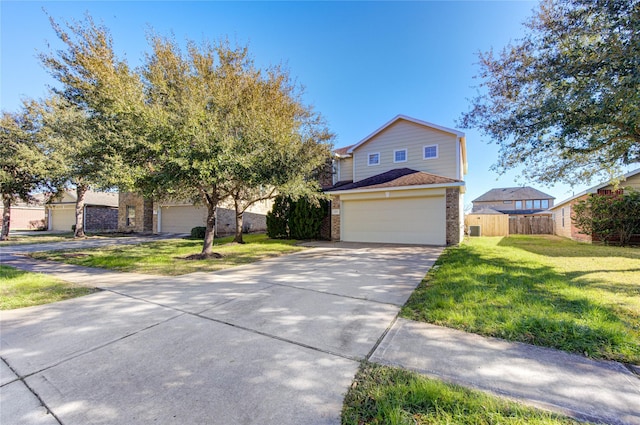 view of front of property with a garage and a front yard