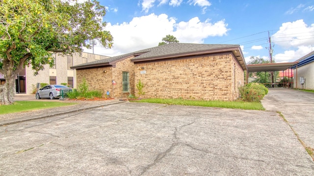 view of home's exterior featuring a carport