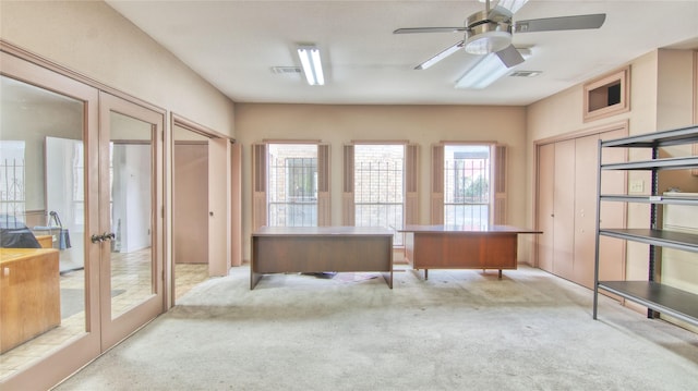 office with light colored carpet, ceiling fan, and french doors