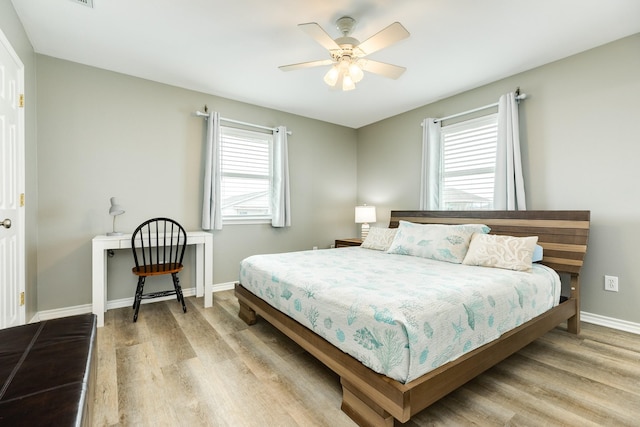 bedroom featuring ceiling fan and light hardwood / wood-style floors