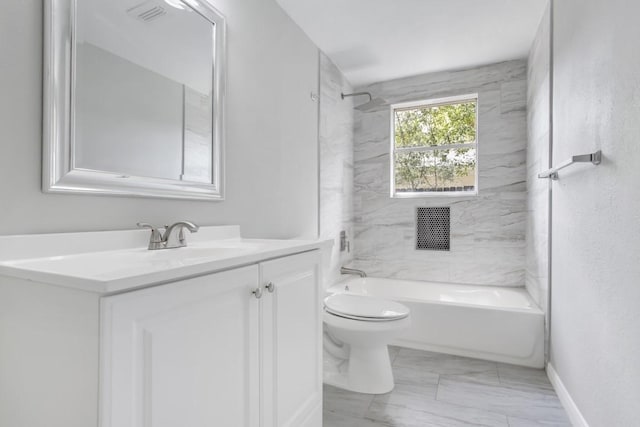 full bathroom featuring vanity, toilet, and tiled shower / bath combo