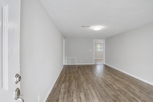 3114 Carolyn St, Bacliff, TX 77518 - empty room with wood finished floors and baseboards