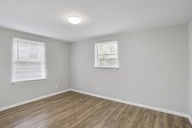 unfurnished room featuring wood-type flooring