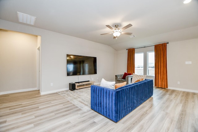 living room featuring vaulted ceiling, ceiling fan, and light hardwood / wood-style floors