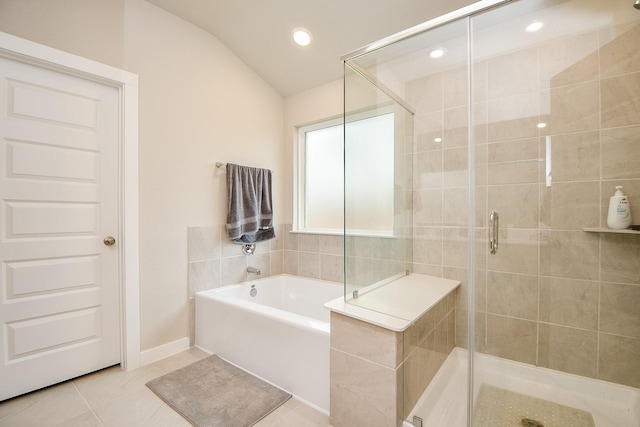 bathroom featuring tile patterned floors, plus walk in shower, and vaulted ceiling