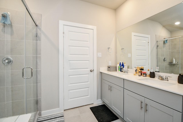 bathroom featuring walk in shower, tile patterned floors, and vanity