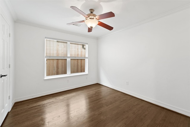 empty room with dark wood-type flooring, ornamental molding, and ceiling fan