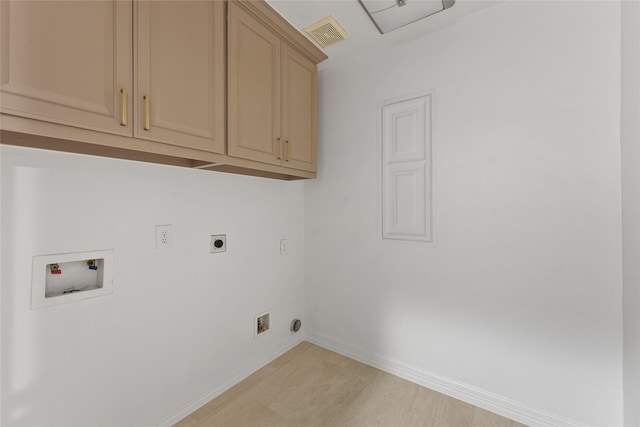 washroom with cabinets, electric dryer hookup, and hookup for a washing machine