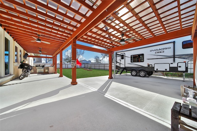 exterior space with a yard and ceiling fan