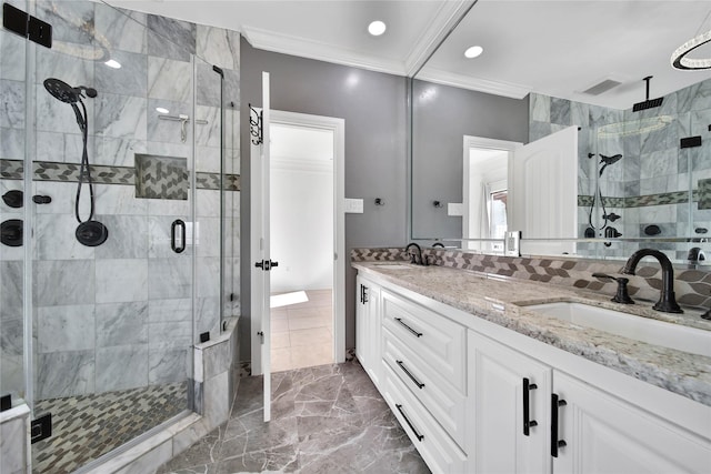 bathroom featuring an enclosed shower, ornamental molding, and vanity