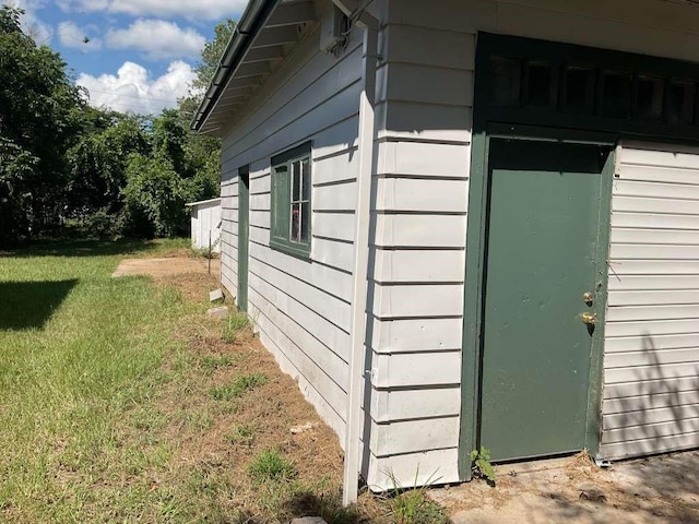 view of home's exterior with a yard