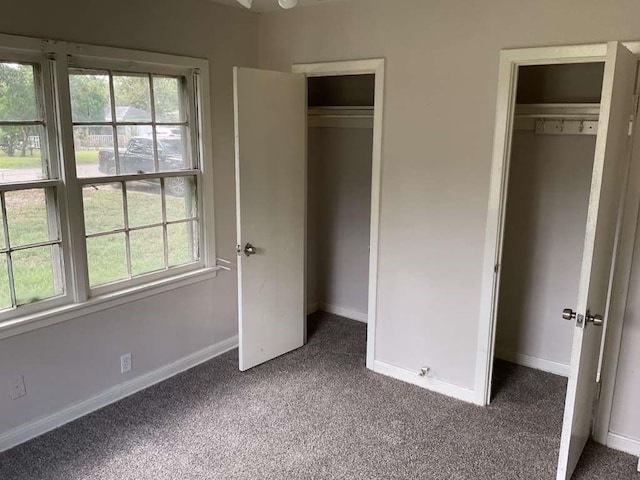 unfurnished bedroom with a closet and carpet flooring