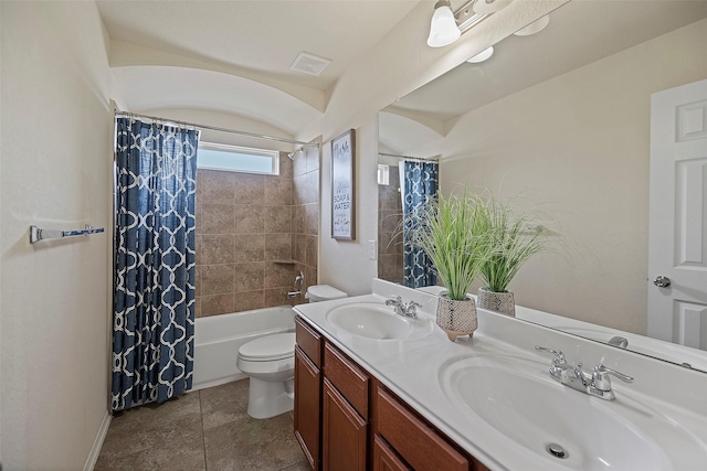 full bathroom featuring toilet, vanity, and shower / bath combo with shower curtain