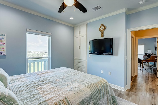 bedroom with light hardwood / wood-style flooring, ornamental molding, and ceiling fan