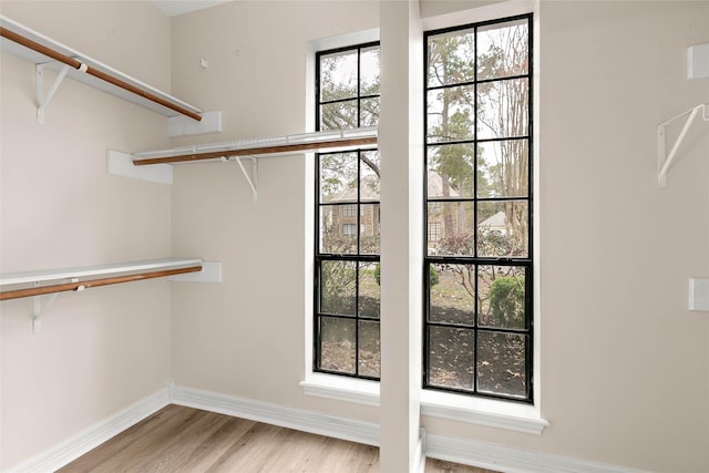 walk in closet featuring light hardwood / wood-style floors