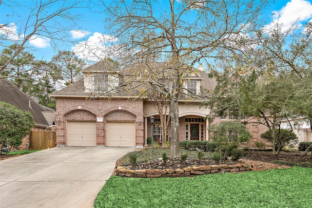 view of front of house featuring a garage and a front lawn