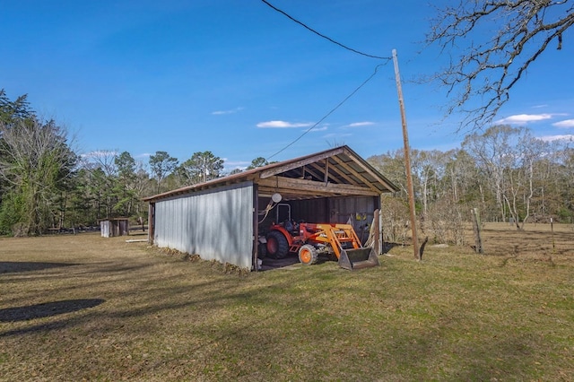 view of outdoor structure featuring a lawn