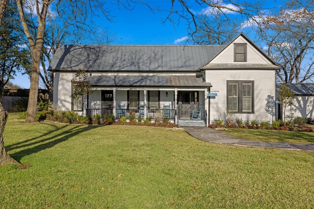 view of front of home featuring covered porch and a front lawn