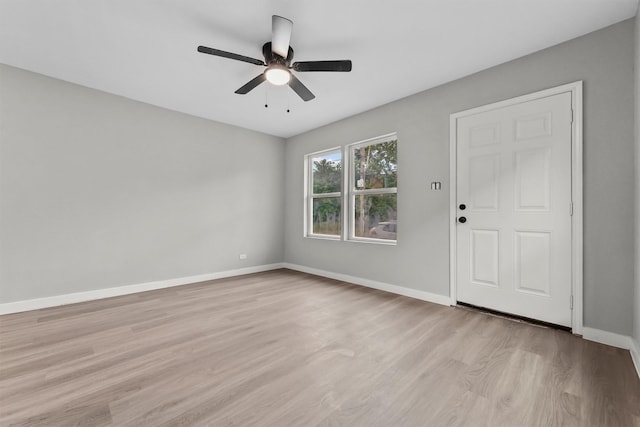 spare room featuring ceiling fan and light hardwood / wood-style floors