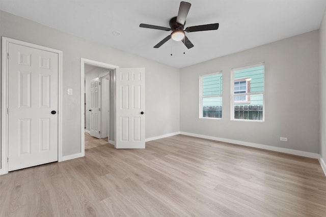 unfurnished bedroom with ceiling fan and light wood-type flooring