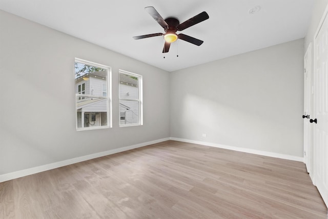 unfurnished room with ceiling fan and light wood-type flooring