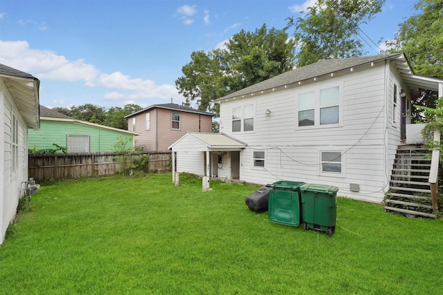 back of house with a yard