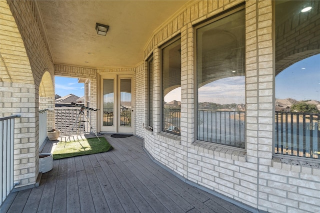 wooden deck with a water view