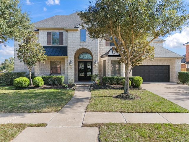 view of front facade featuring a front yard and french doors