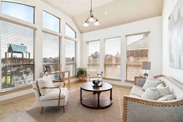 sunroom / solarium featuring lofted ceiling and a notable chandelier