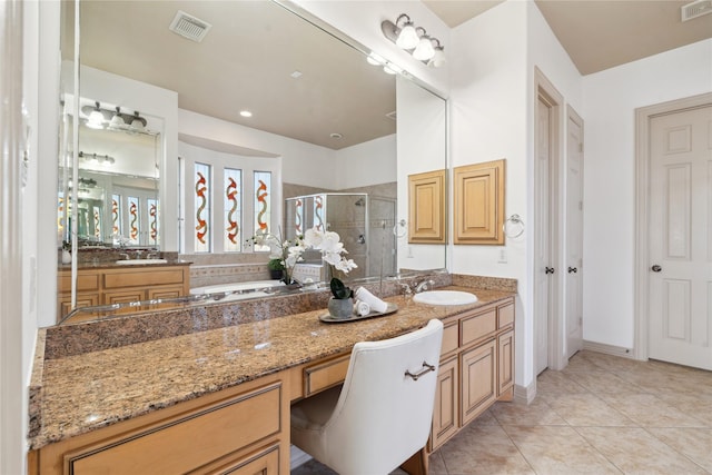 bathroom with tile patterned floors, vanity, and a shower with shower door