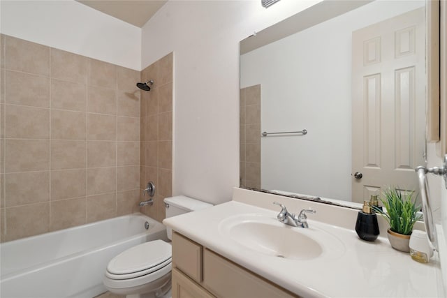 full bathroom with vanity, toilet, and tiled shower / bath combo