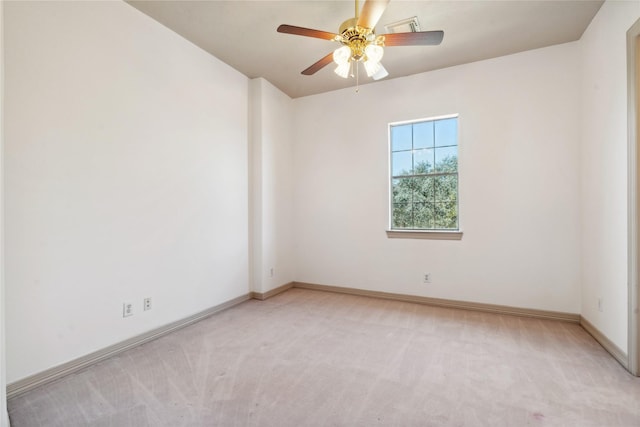 unfurnished room featuring ceiling fan and light carpet