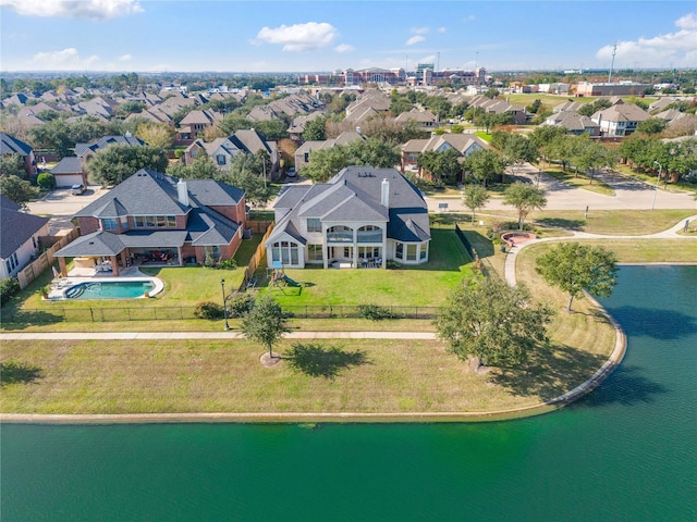 birds eye view of property with a water view