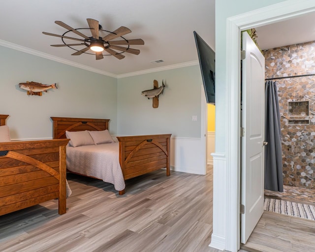 bedroom with light hardwood / wood-style flooring, ornamental molding, and ceiling fan