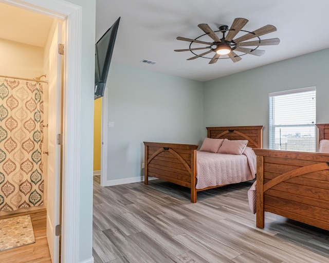 bedroom featuring ceiling fan and light hardwood / wood-style flooring