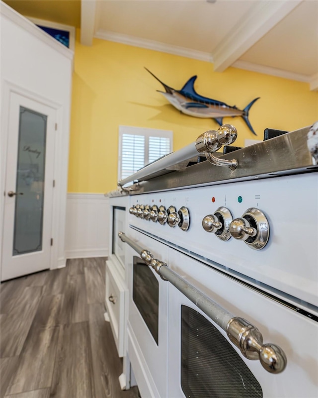 room details featuring beamed ceiling, ornamental molding, and wood-type flooring