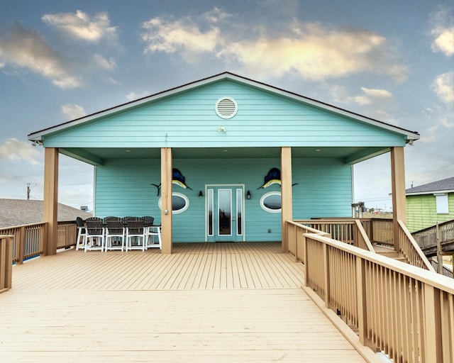 back of house with a wooden deck