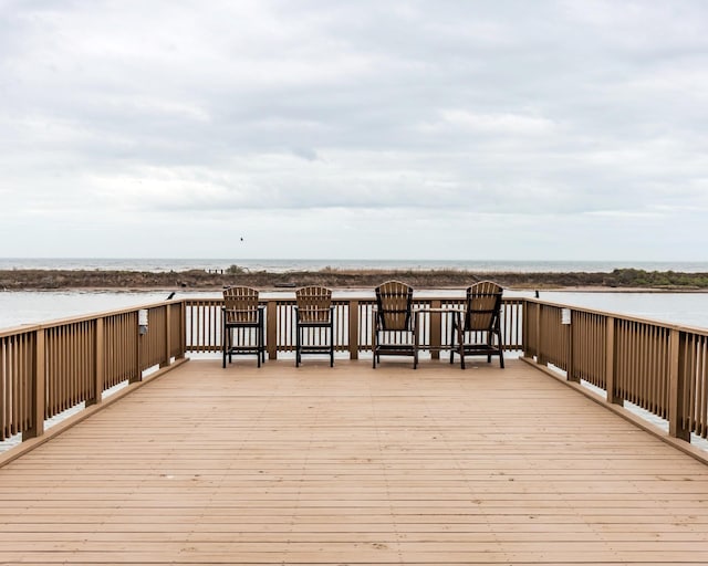 wooden deck featuring a water view