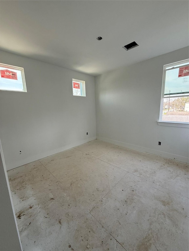 empty room featuring a wealth of natural light