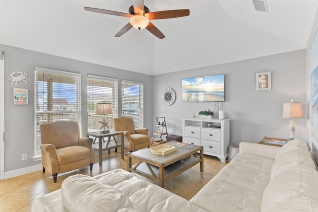 living room with light tile patterned floors, vaulted ceiling, and ceiling fan