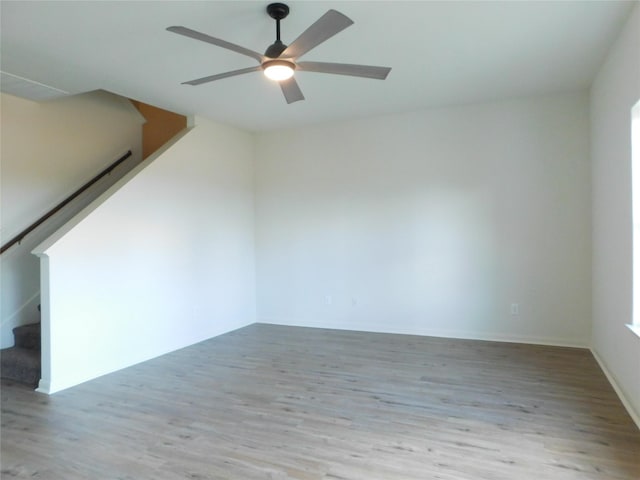 spare room with ceiling fan and light hardwood / wood-style floors